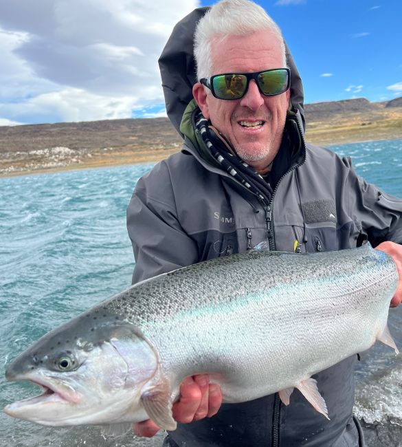 Derek Manson holding rainbow trout in Estancia Laguna Verde